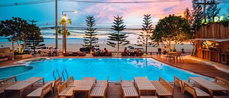 Outdoor pool, open 7 AM to 7:00 PM, free pool cabanas, pool umbrellas