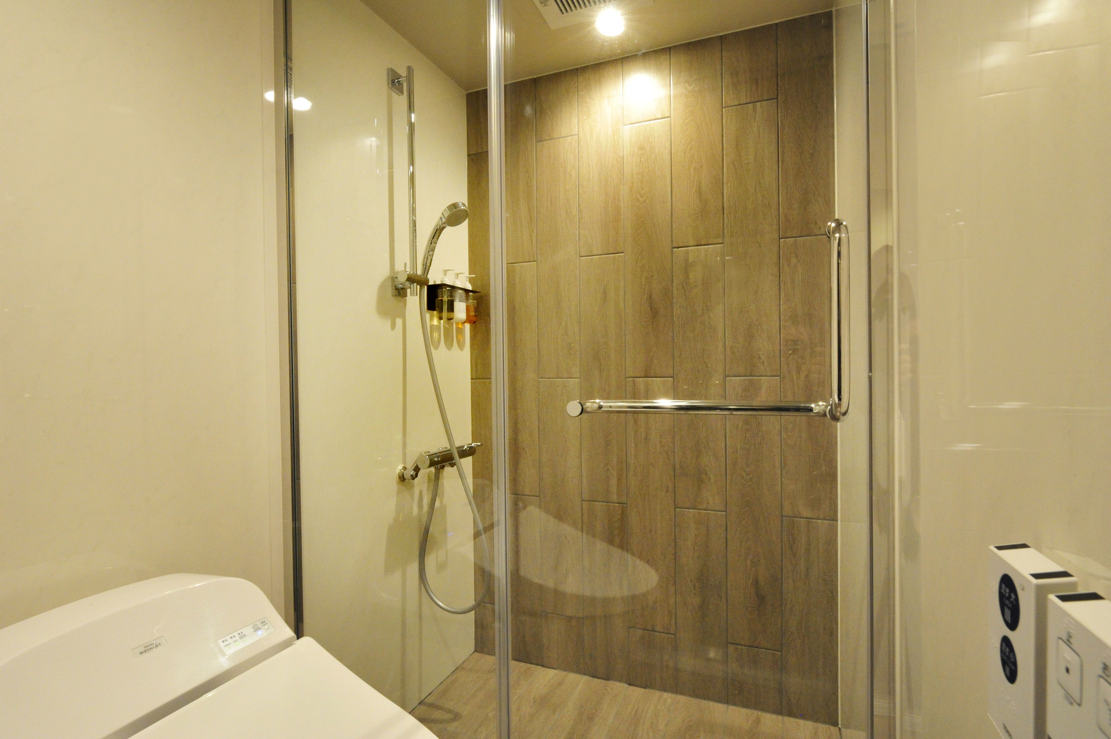 hair dryer, slippers, electronic bidet, towels