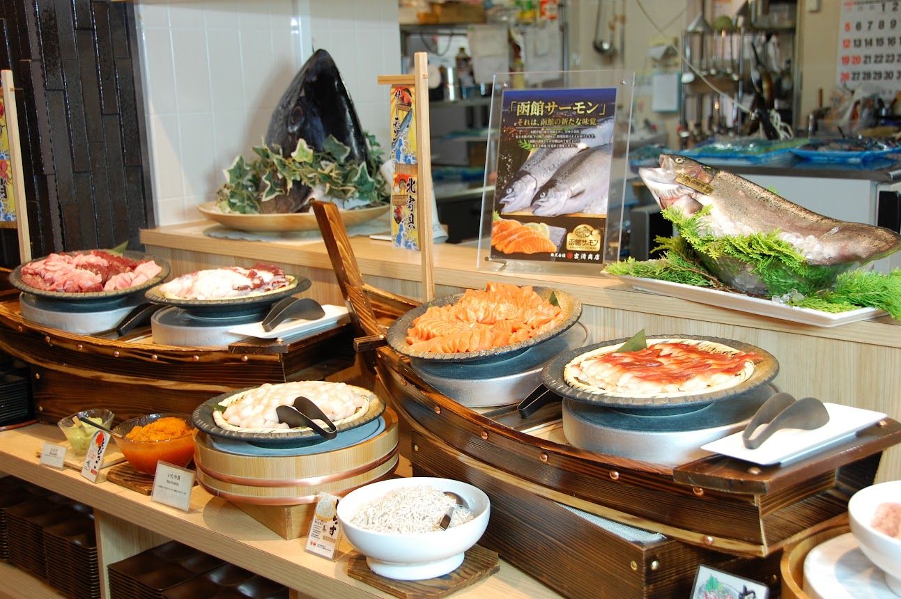 A buffet with various dishes including seafood, salads, and rice.