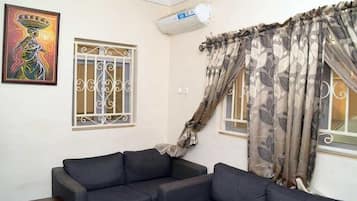 Apartment, 2 Bedrooms | Living room | Flat-screen TV