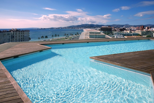 Outdoor pool, open 10:30 AM to 6:30 PM, pool umbrellas, sun loungers