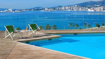 Outdoor pool, open 10:30 AM to 6:30 PM, pool umbrellas, sun loungers