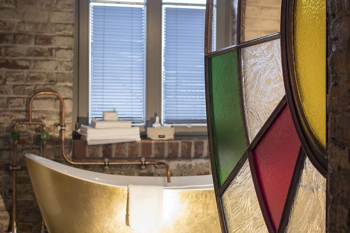 exclusive suite, 1 king bed, non smoking | bathroom | free toiletries, hair dryer, slippers, towels