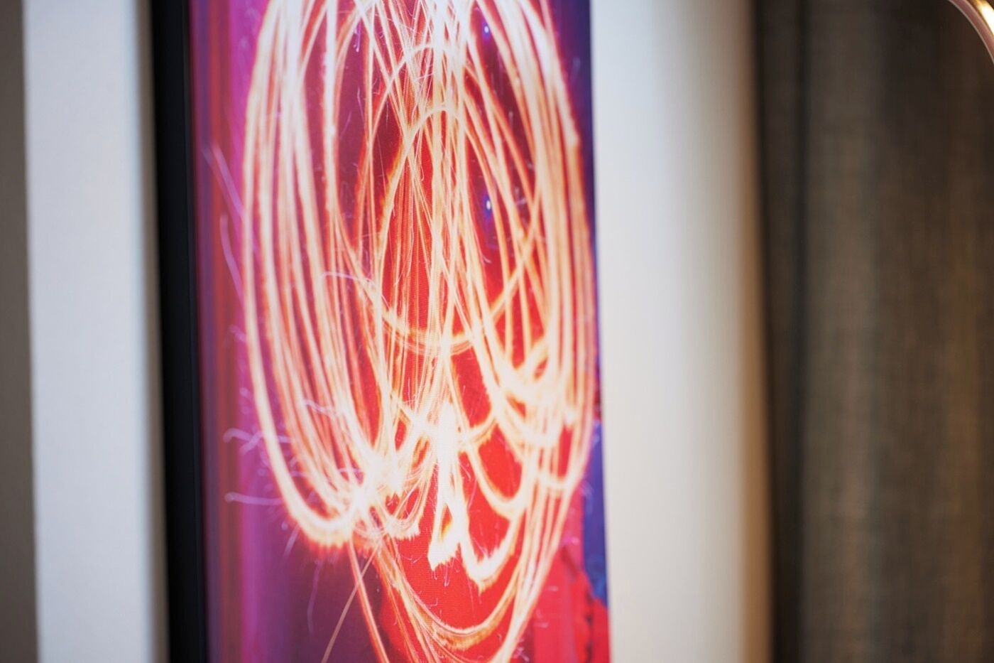A close-up of a light trail effect, likely from a light painting photography technique.