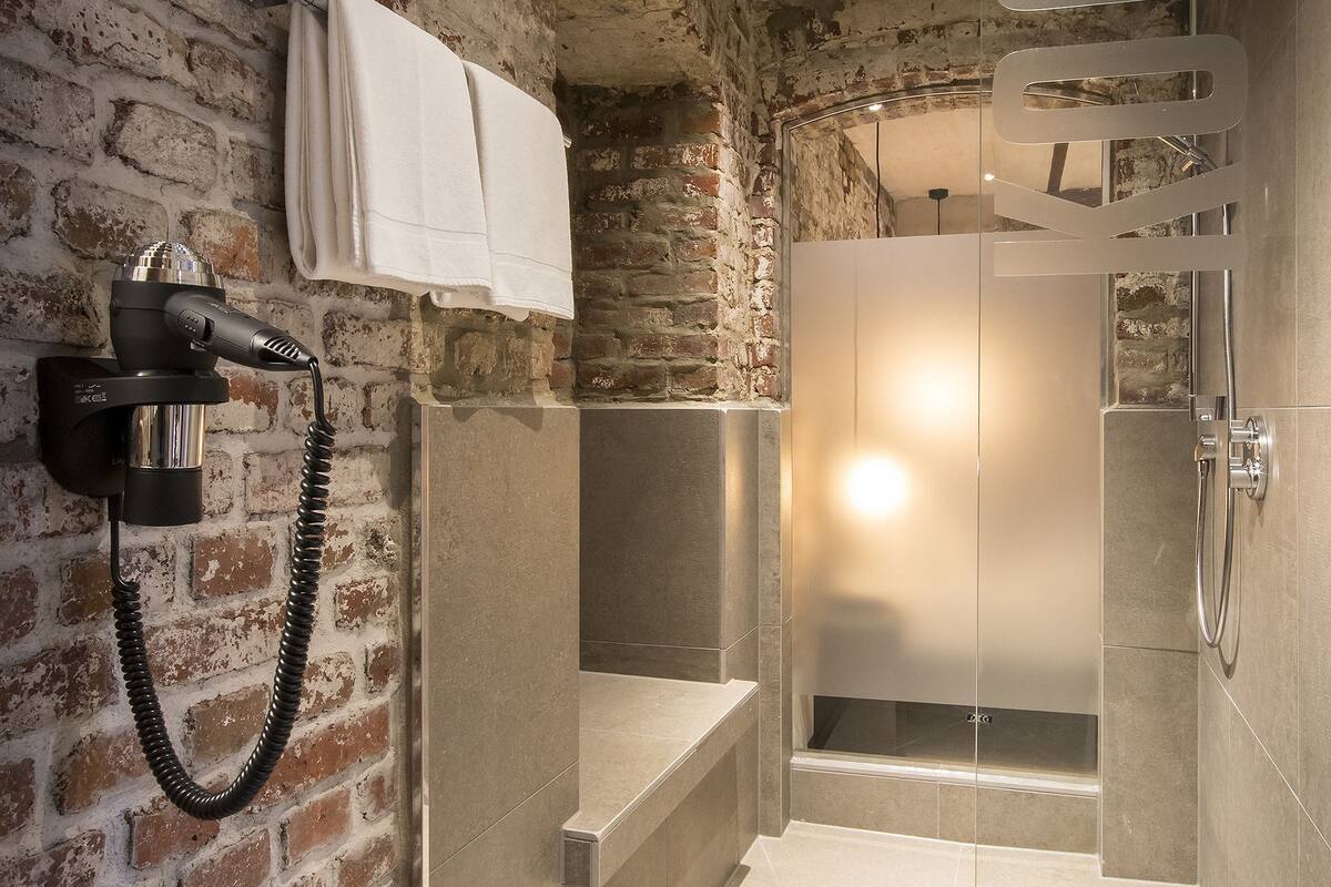 exclusive suite, 1 king bed, non smoking | bathroom | free toiletries, hair dryer, slippers, towels