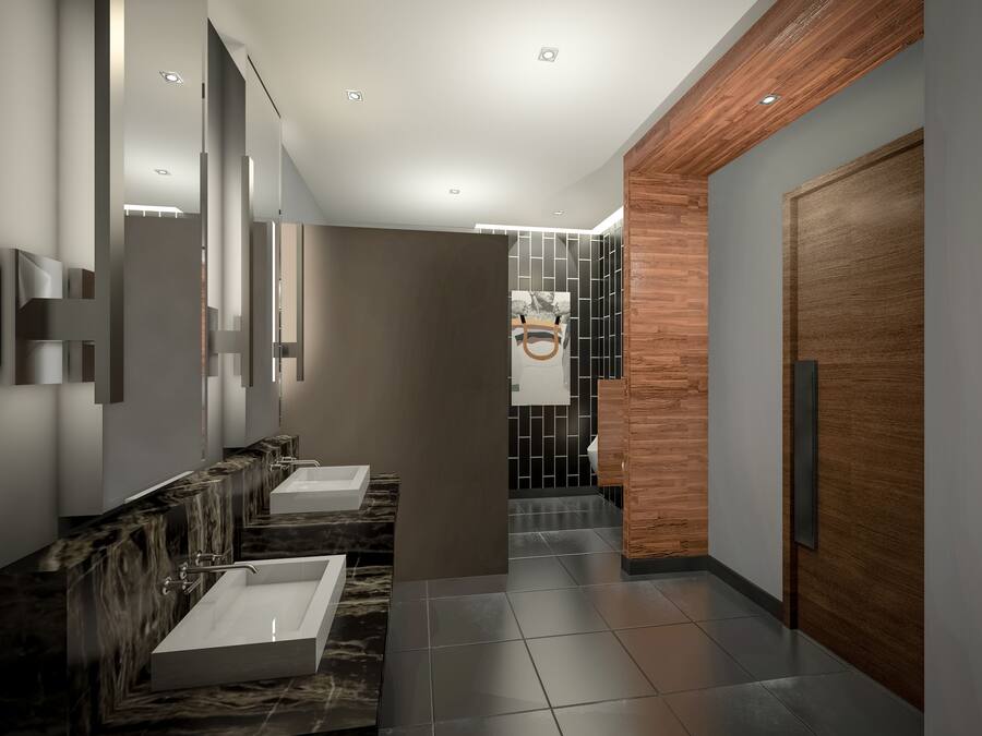 A modern bathroom with two sinks, a wooden accent wall, and a tiled floor.