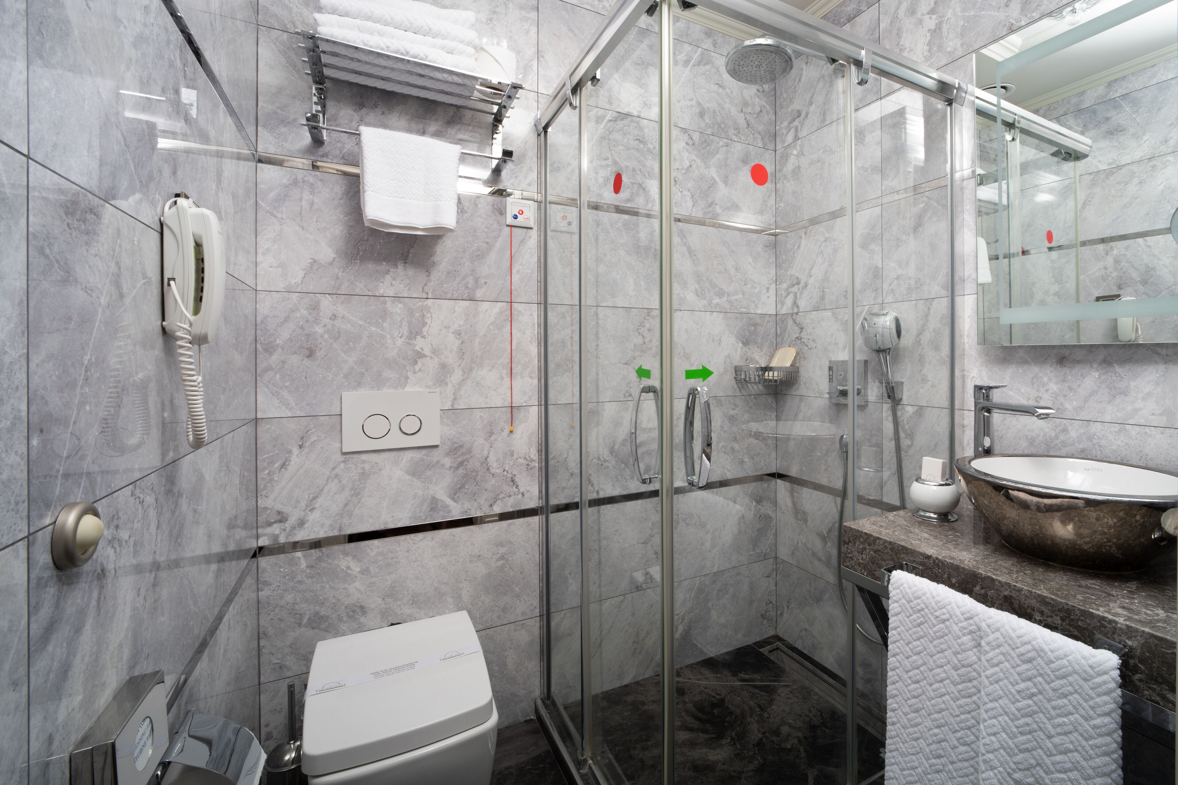 corner king room sea view | bathroom | shower, rainfall showerhead, designer toiletries, hair dryer