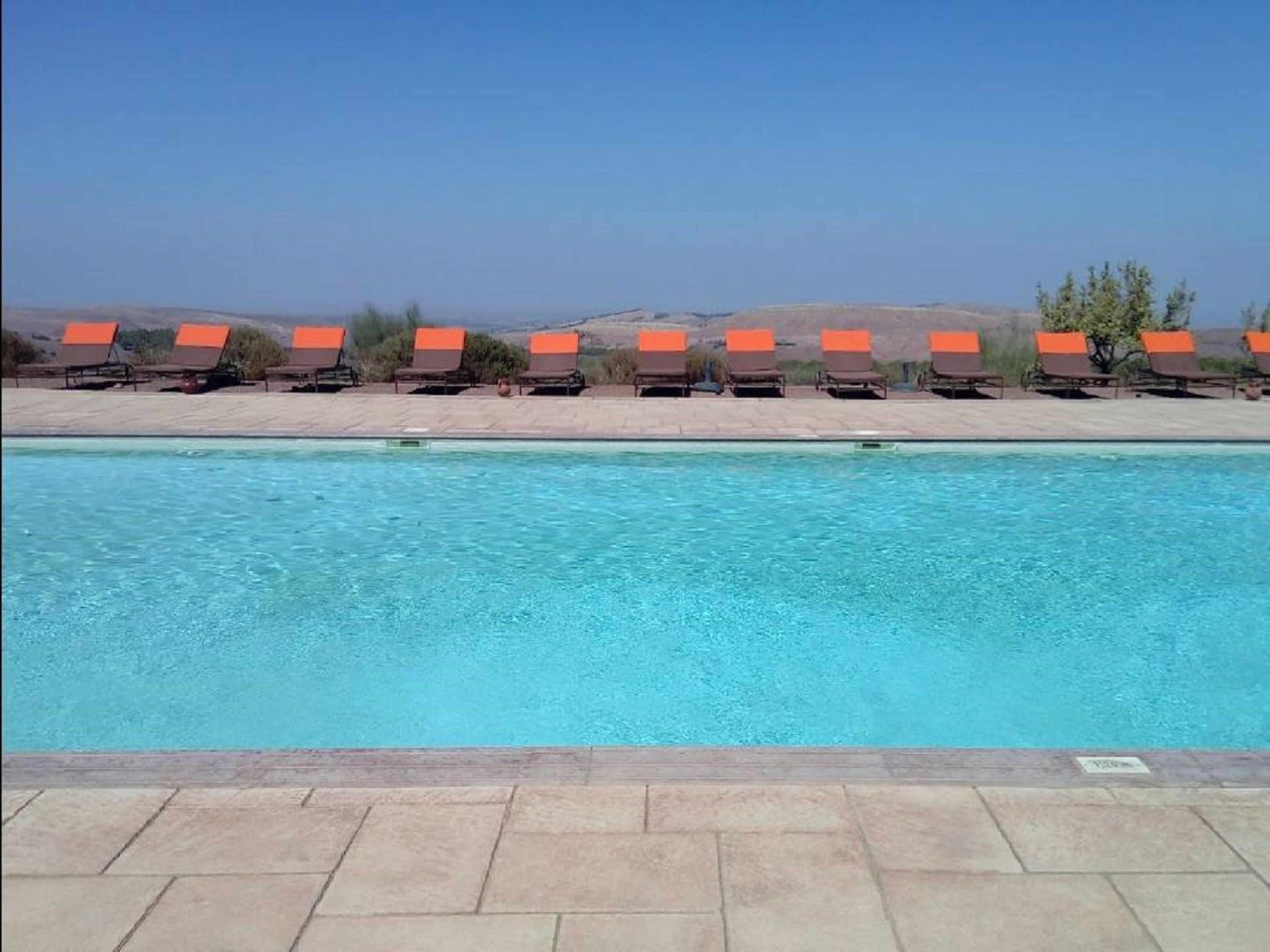 2 outdoor pools, pool umbrellas, pool loungers