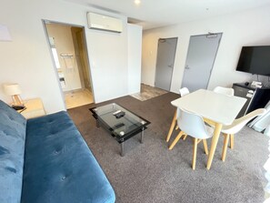 Two-Bedroom Apartment | Living area | 43-inch Smart TV with satellite channels, TV, Netflix - 2 on Whiteleigh and 239 on Lincoln Motel (Christchurch)