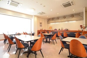 A conference room with tables and chairs, air conditioning vents, and a window with blinds. - Iki Marina Hotel (Iki)