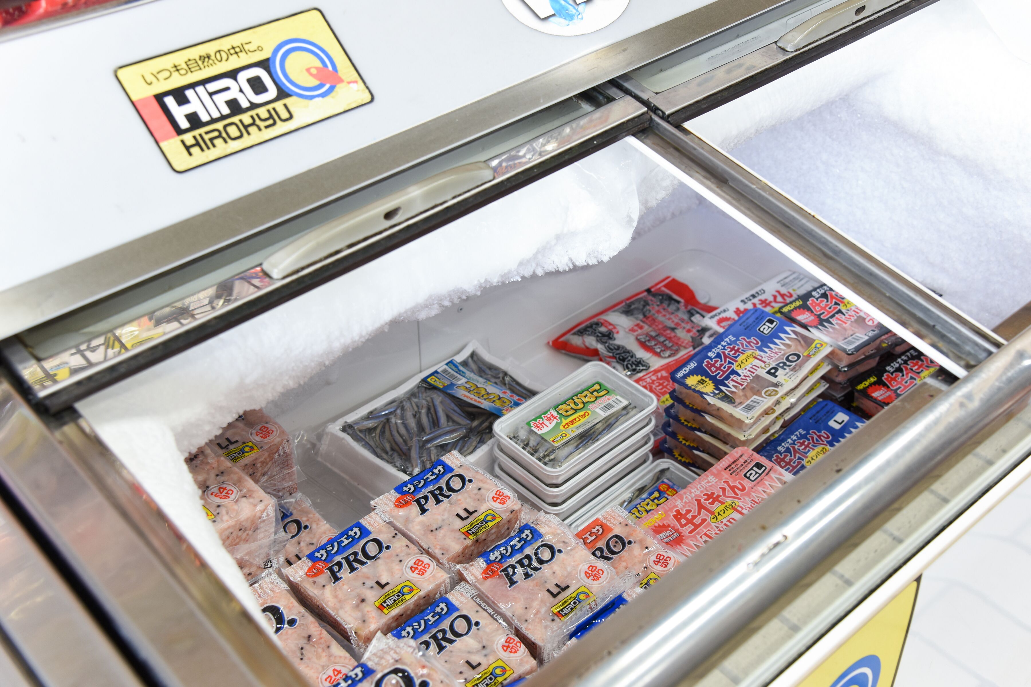A freezer with various packaged meats and seafood.