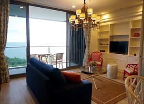 2 Bedroom Apartment with Sea View | Living area | TV - Baan Plai Haad Beachfront Condominium (Pattaya)