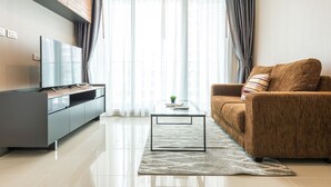 1 Bedroom Condominium | Living room | 43-inch LCD TV with satellite channels, TV - TC Green by Jummie (Bangkok)