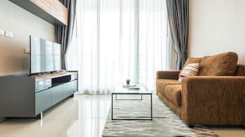 1 Bedroom Condominium | Living room | 43-inch LCD TV with satellite channels, TV
