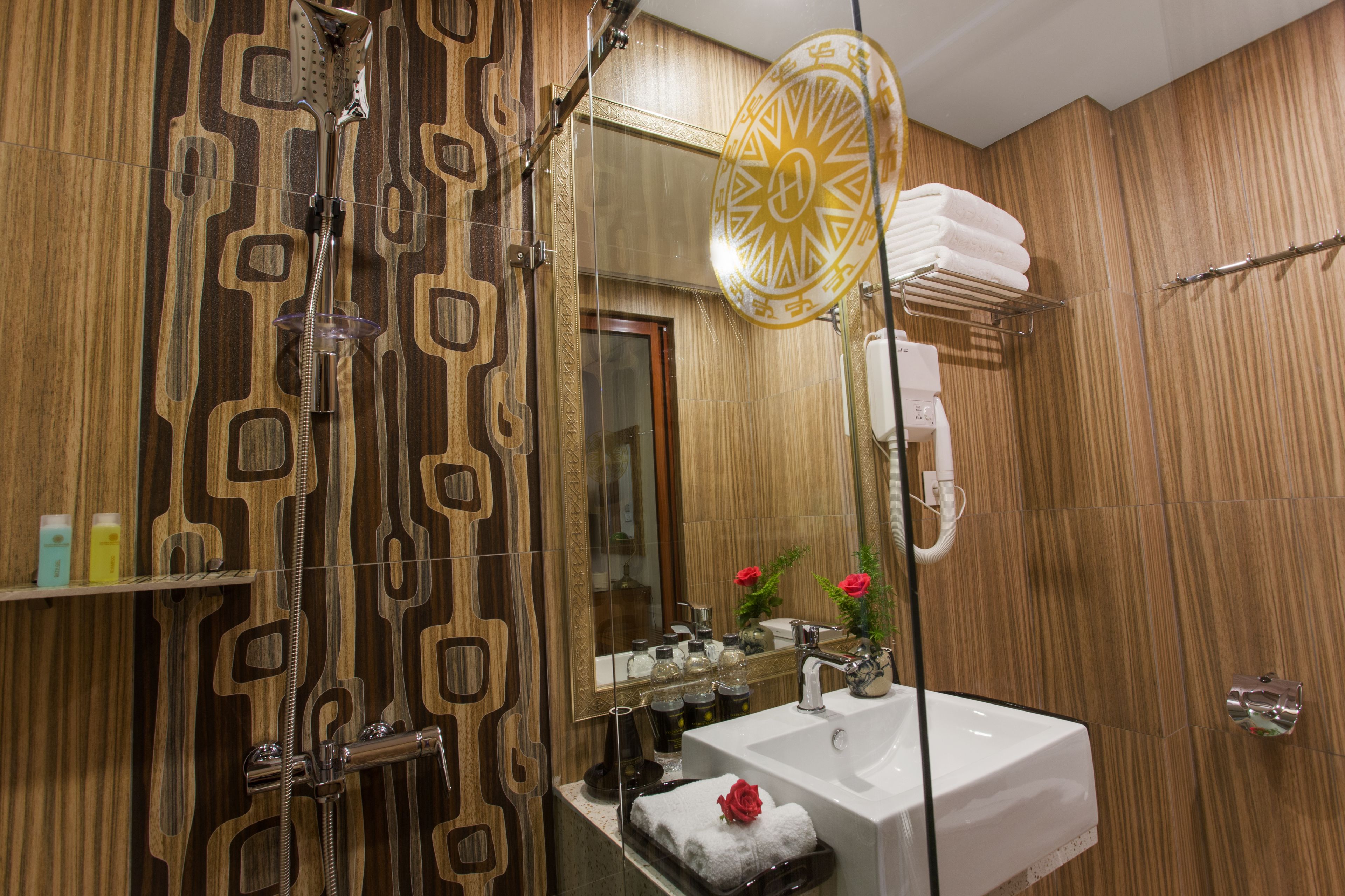 hydromassage showerhead, designer toiletries, hair dryer, bathrobes