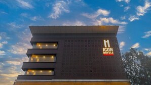 A hotel building with a modern design, featuring a prominent 'H ICON HOTELS' sign on the facade. - Icon Business by Bhagini  (Bengaluru)