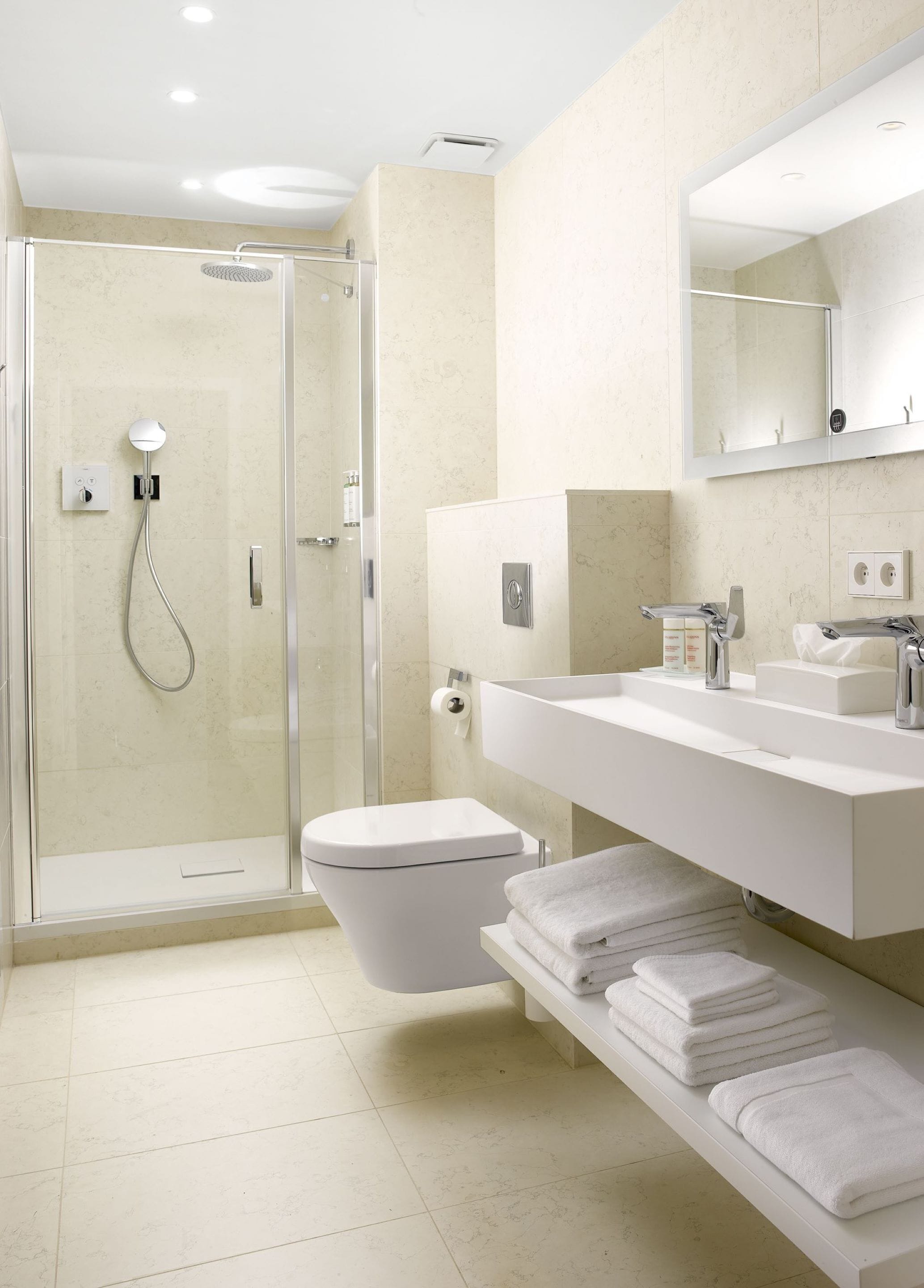 designer toiletries, hair dryer, bathrobes, towels