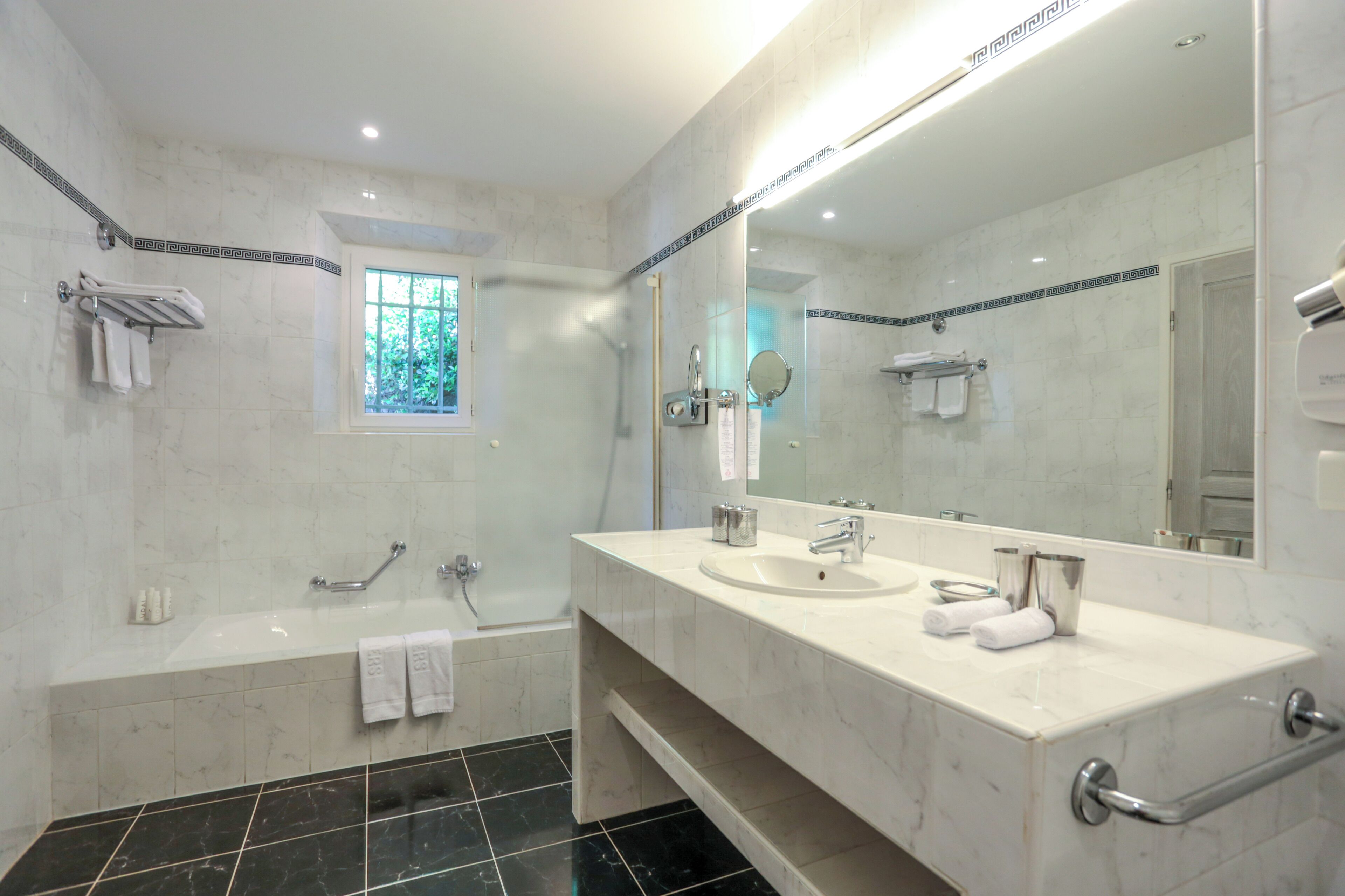 deep-soaking bathtub, free toiletries, hair dryer, bathrobes