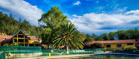 2 outdoor pools, open 7:00 AM to 9:00 PM, pool loungers