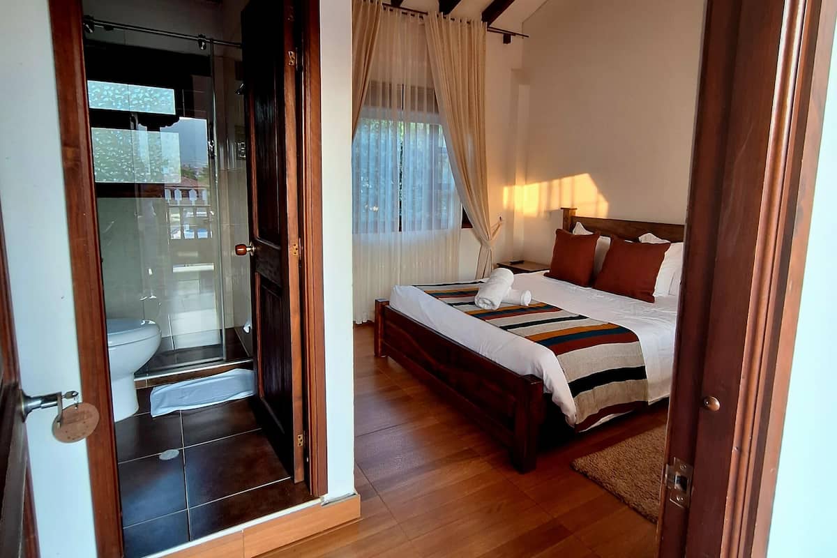 Premium bedding, down comforters, blackout drapes, iron/ironing board