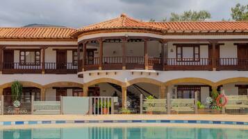 Outdoor pool, open 9:00 AM to 10:00 PM, pool umbrellas, sun loungers