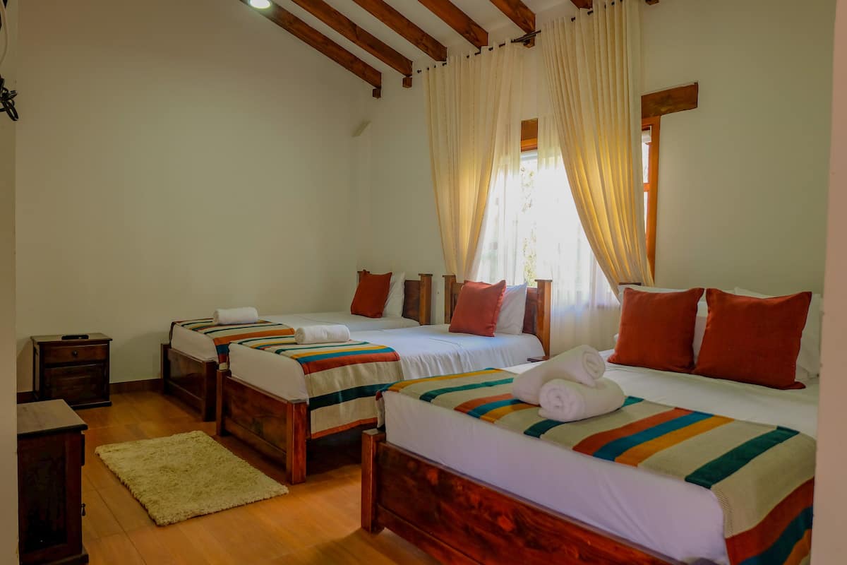 Quadruple Room | Premium bedding, down comforters, blackout drapes, iron/ironing board