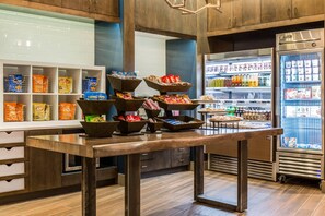 A snack bar with various packaged snacks and beverages. - Cambria Hotel Chicago Loop - Theatre District (Chicago)