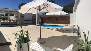 Outdoor pool, pool umbrellas, pool loungers