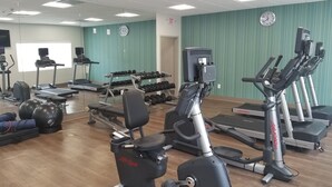 A gym with cardio machines, weight benches, and dumbbells. - Holiday Inn Express & Suites Fort Mill by IHG (Fort Mill)