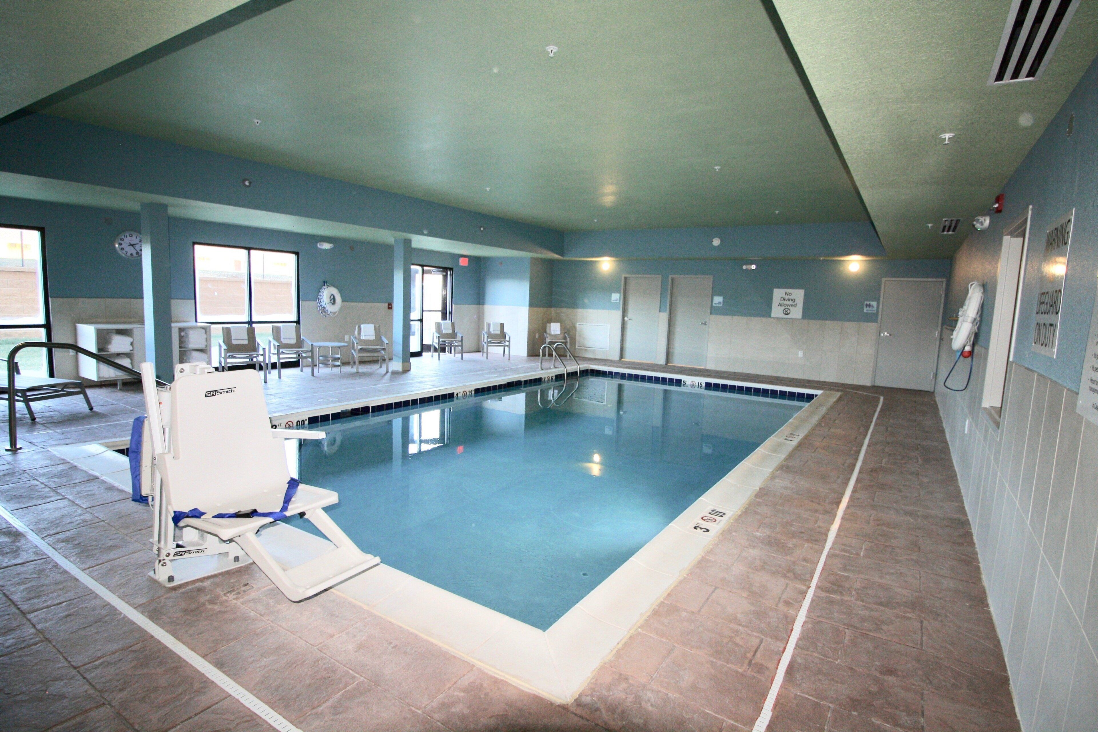 Indoor pool, open 7 AM to 11 PM, pool loungers
