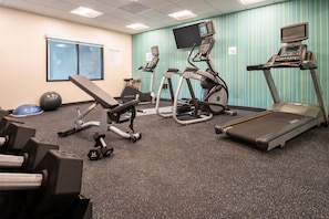 A fitness center with treadmills, elliptical machines, a bench, and free weights. - Holiday Inn Express & Suites Camas - Vancouver by IHG (Camas)