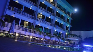 A multi-story hotel with balconies, outdoor seating, and a pool area. - Villa Israel Eco Park El nido Palawan (El Nido)