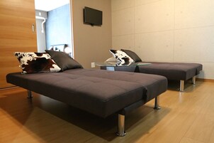 Superior A, Non Smoking | Living area | Flat-screen TV