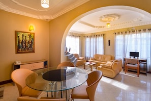 Family House, 3 Bedrooms, Mountain View | Living area | 32-inch LED TV with cable channels, TV - The Lodge Tellamande (Arusha)