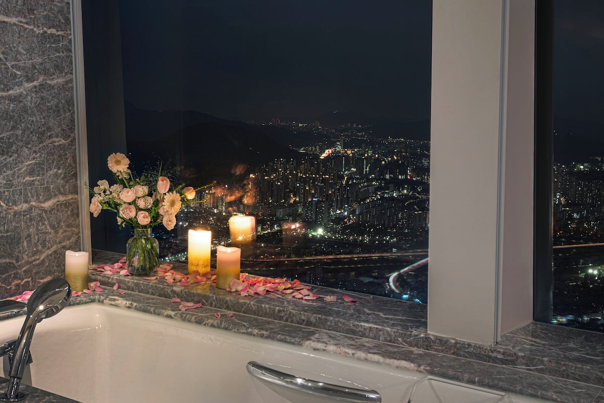 separate bathtub and shower, deep-soaking bathtub, designer toiletries