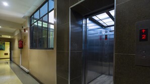 An elevator with a digital display indicating the floor number.