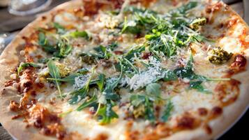 A pizza with various toppings.
