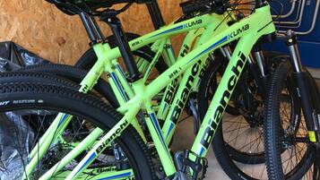 A bicycle with a bright green frame and black components, including the seat and handlebars.