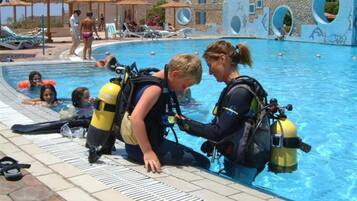 Relax by the pool surrounded by lounge chairs and umbrellas, where you can enjoy a refreshing swim or try your hand at diving.