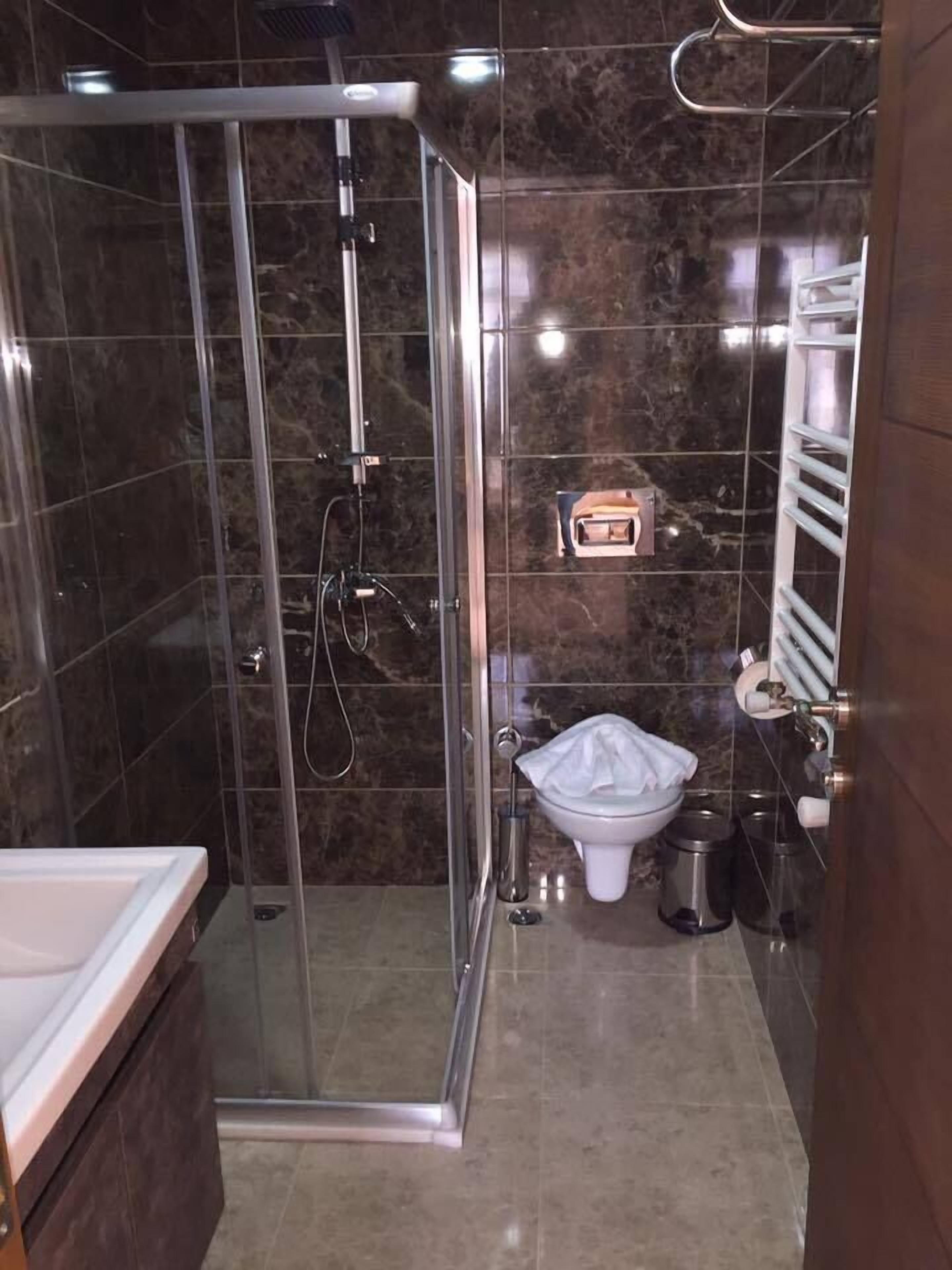 Shower, free toiletries, hair dryer, slippers