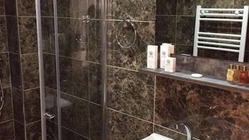 Shower, free toiletries, hair dryer, slippers