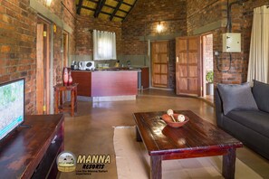 Executive Chalet, Kitchenette, Garden View | Living area | TV - Manna Resorts (Harare)