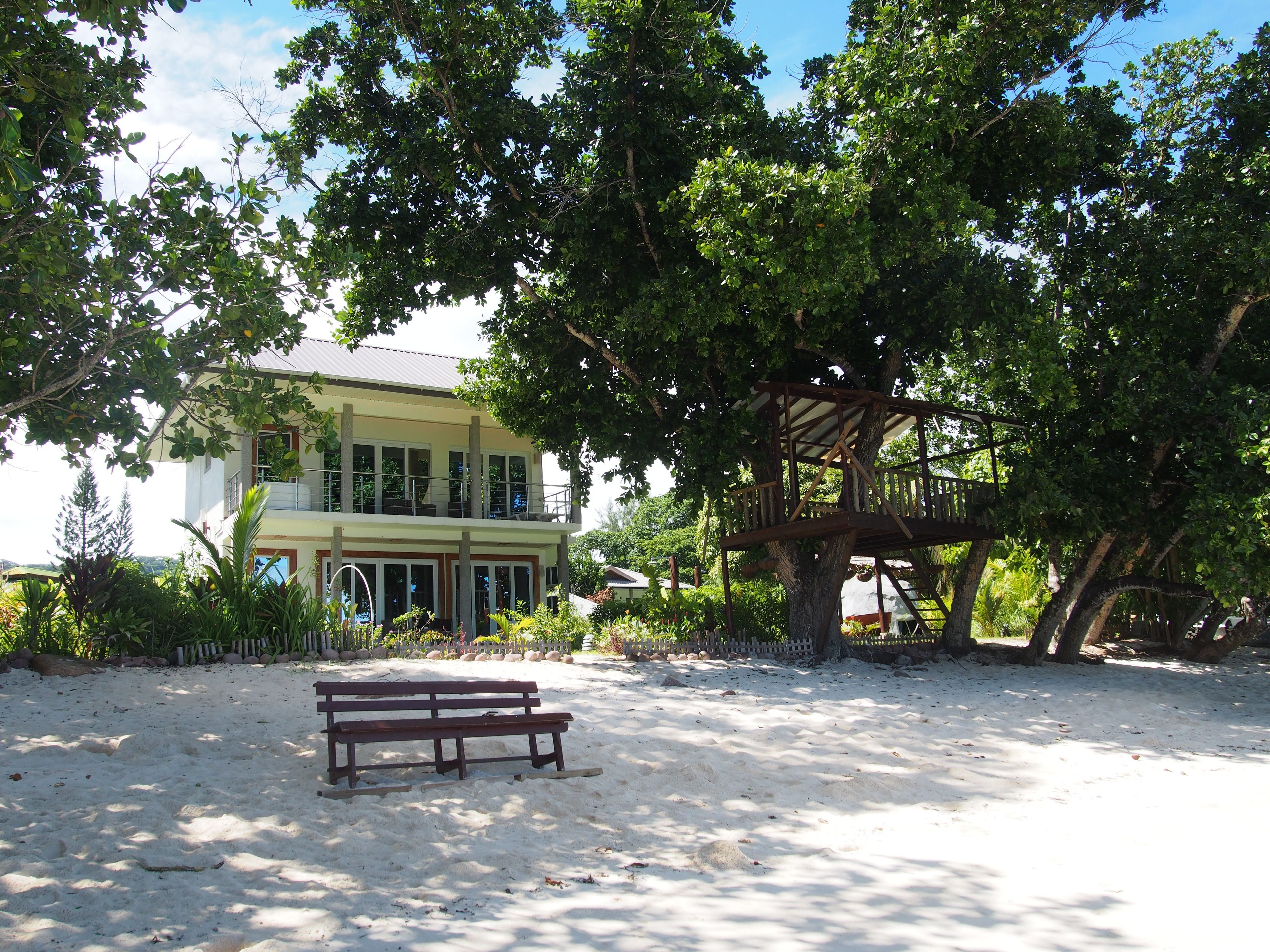 On the beach, white sand, sun loungers, beach towels