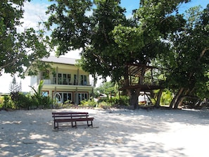 On the beach, white sand, sun loungers, beach towels