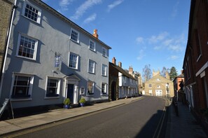 Stunning traditional building with a symmetrical facade and central doorway.
