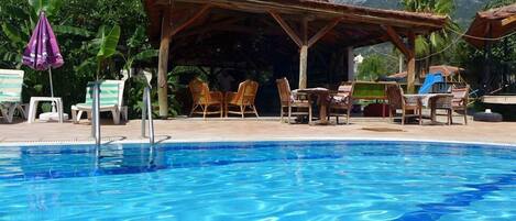 Seasonal outdoor pool, pool umbrellas, sun loungers