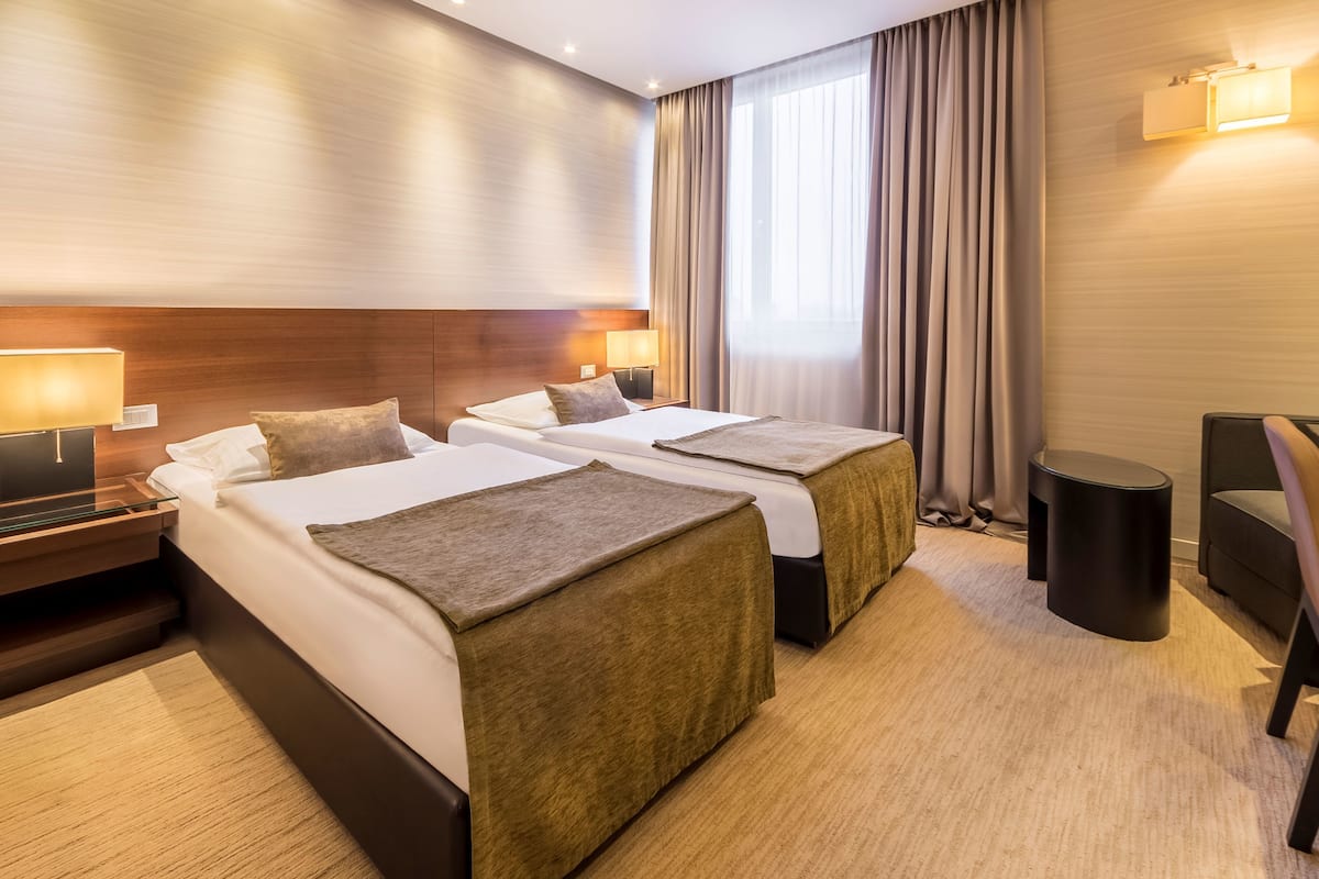 Superior Twin Room | Minibar, in-room safe, desk, soundproofing