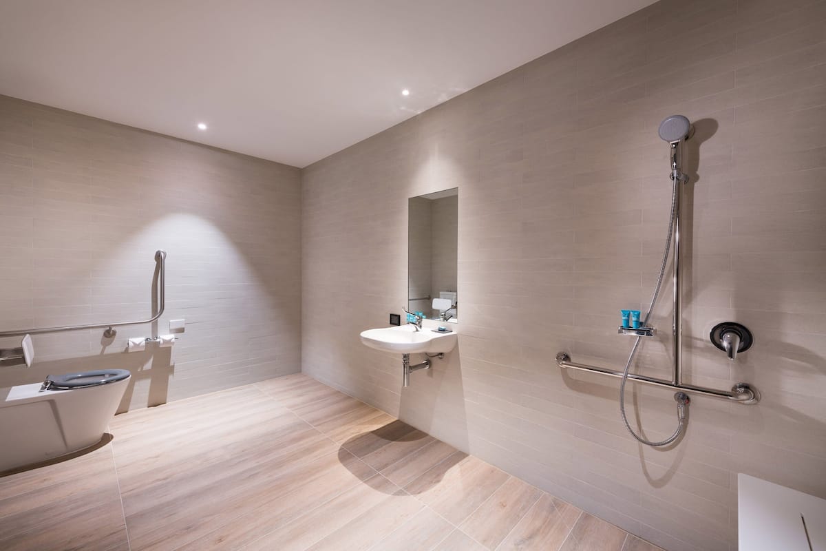 aloft, room, 1 king bed, non smoking | bathroom | shower, rainfall showerhead, free toiletries, hair dryer