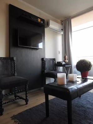Standard Apartment, 2 Bedrooms | Living area | Flat-screen TV - Altos Alameda apartments (Santiago)