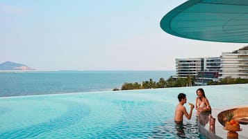 2 outdoor pools, open 9:00 AM to 10:00 PM, pool umbrellas, sun loungers